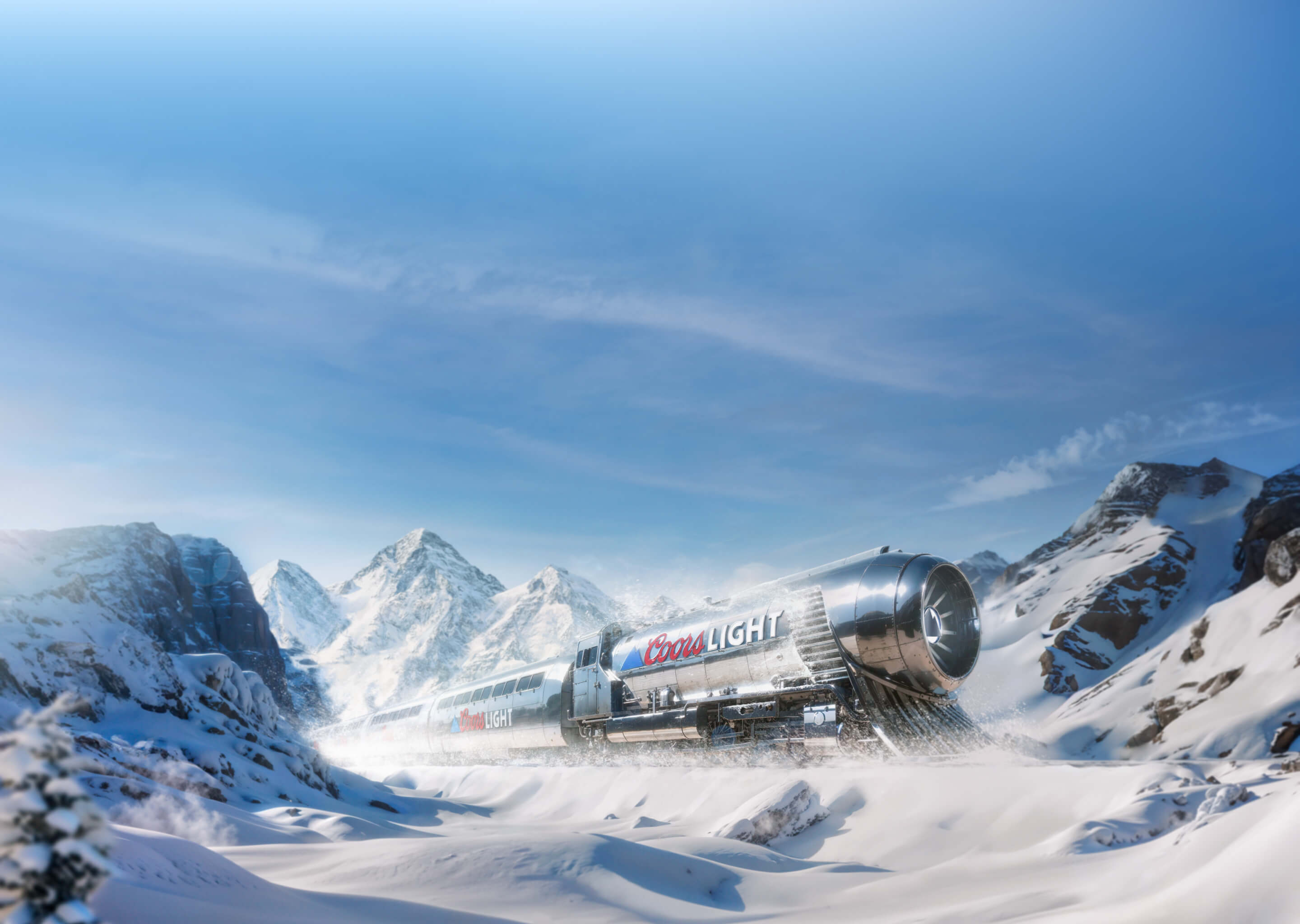 Coors Light beer can on train rails with a mountainous backdrop